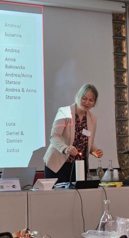 Andrea Ficke lighting a candle to kick-off the second PurPest annual meeting